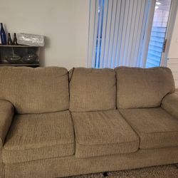 Beige Couch,  Parcel Delivery Boxand TV Stand 