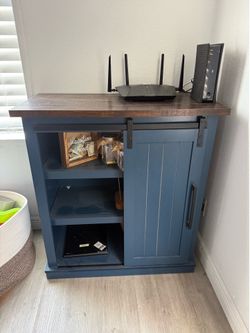 Barn-door accent cabinet