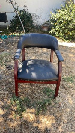 Black vinyl Captain's Chair with casters