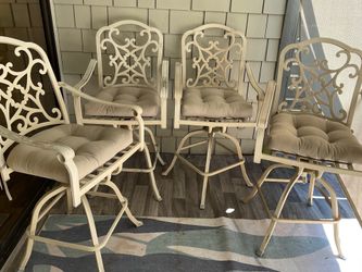 4 Swivel metal patio chairs
