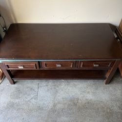  brown glass top wood coffee table features storage drawers and a lower shelf for functional living room storage