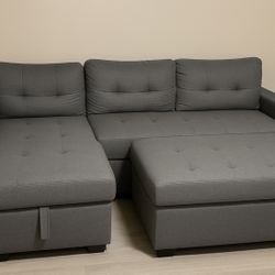 gray L-shaped sectional with matching ottoman Very Clean