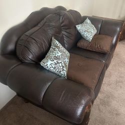 BROWN LEATHER LOVESEAT