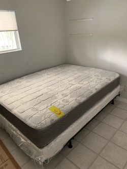 New queen mattress and box spring. 2 pc bed frame is not included