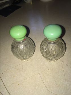 Two vintage Avon perfume bottles.