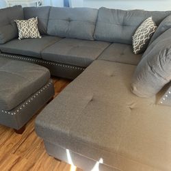 New Reversible Nailhead Sectional.  Grey.  104” X 75”.  Free Delivery!
