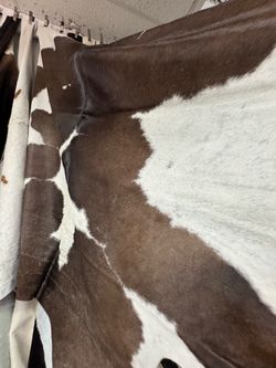 Brown and White Cowhide Rug