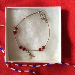 Sterling silver bracelet with red stones - breast cancer awareness