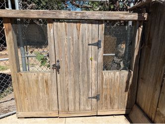 Wood chicken coop door.