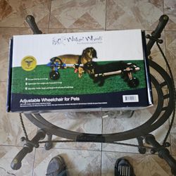 Adjustable wheelchair for small dogs.