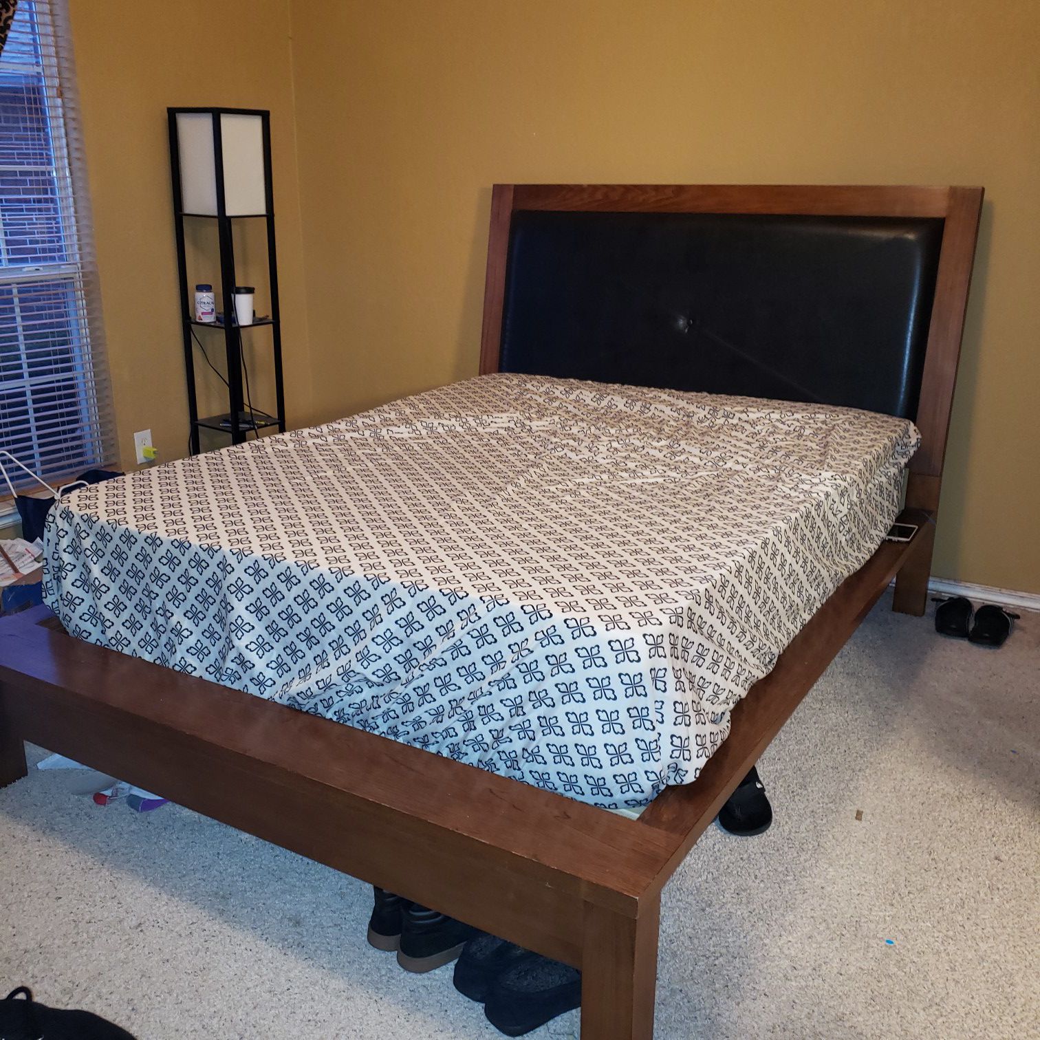 Solid wood queen bed frame.