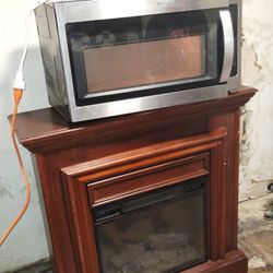 Whirlpool 1.7-cu ft 29.94 In Over The Range Microwave AND Beautiful Wooden Electric Fireplace (Dual Package)!!