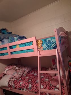 Bunk beds with new mattresses and mattress protectors.