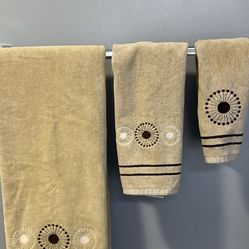 Towel set. One bath towel , one hand towel, and wash cloth Beige and brown