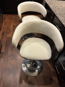 2 large Adjustable barstools faux leather and chrome base