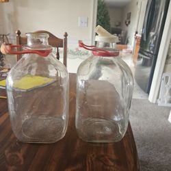 2 Old Glass Milk Bottles