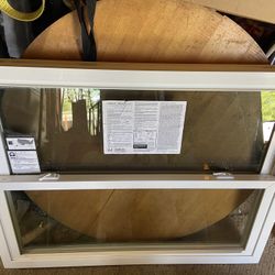 Two Harvey Vinyl Replacement Windows.