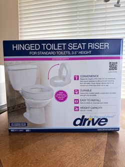 Hinged toilet seat riser