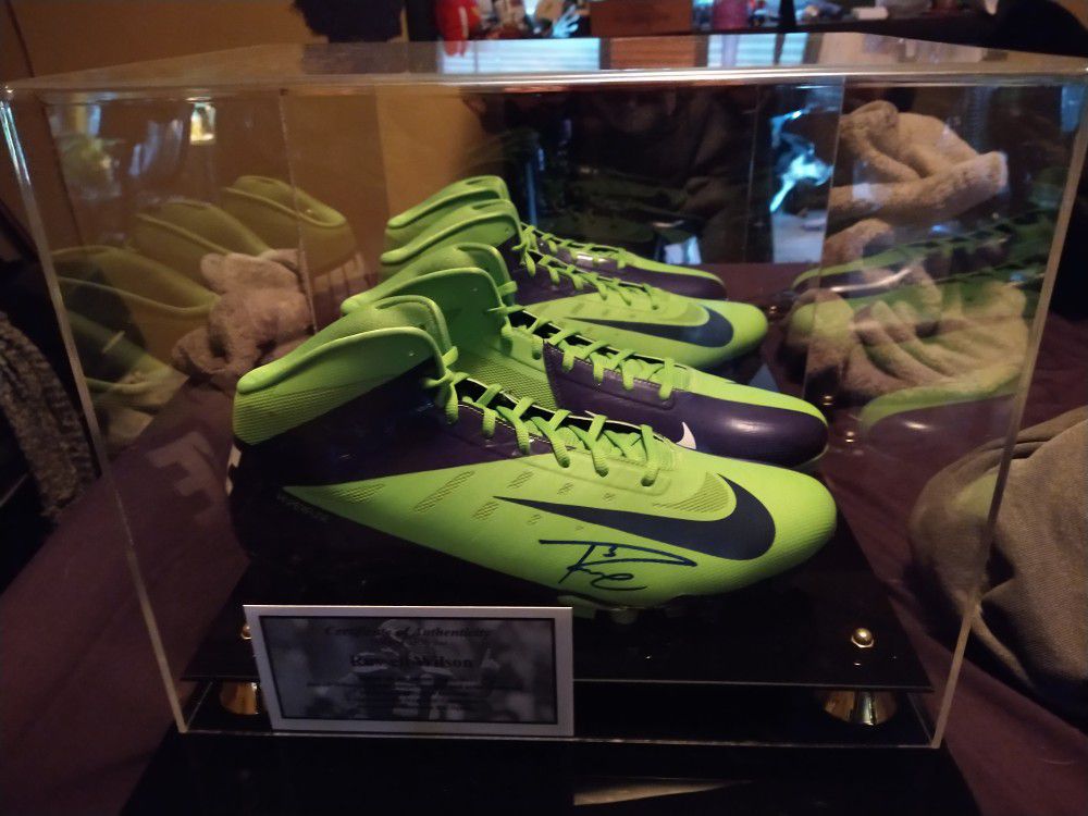 Russell Wilson autographed Nike cleats with display case