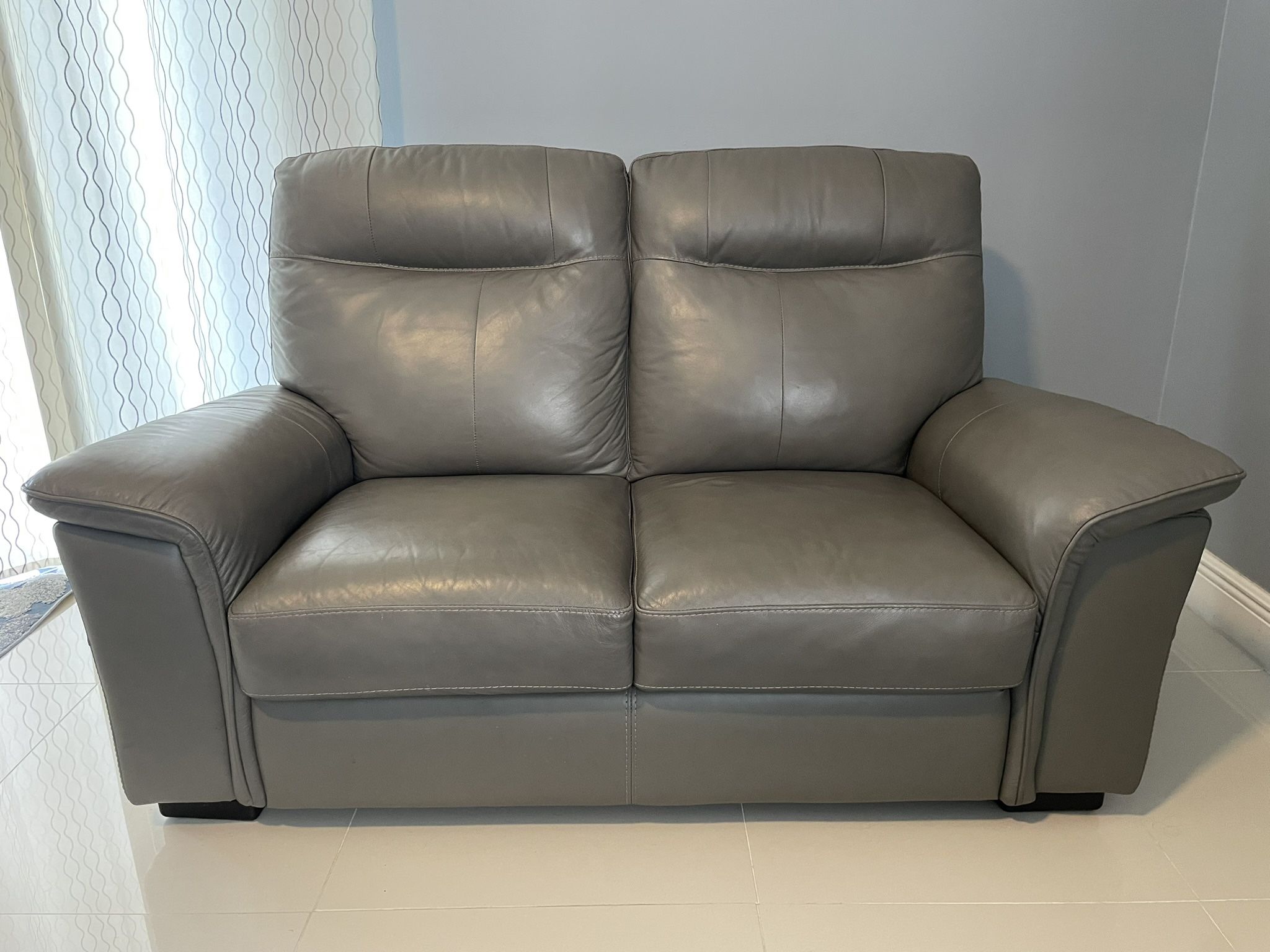 4 Piece Living Room Set: Gray Leather Reclining Couch, Loveseat, Arm Chair and Ottoman