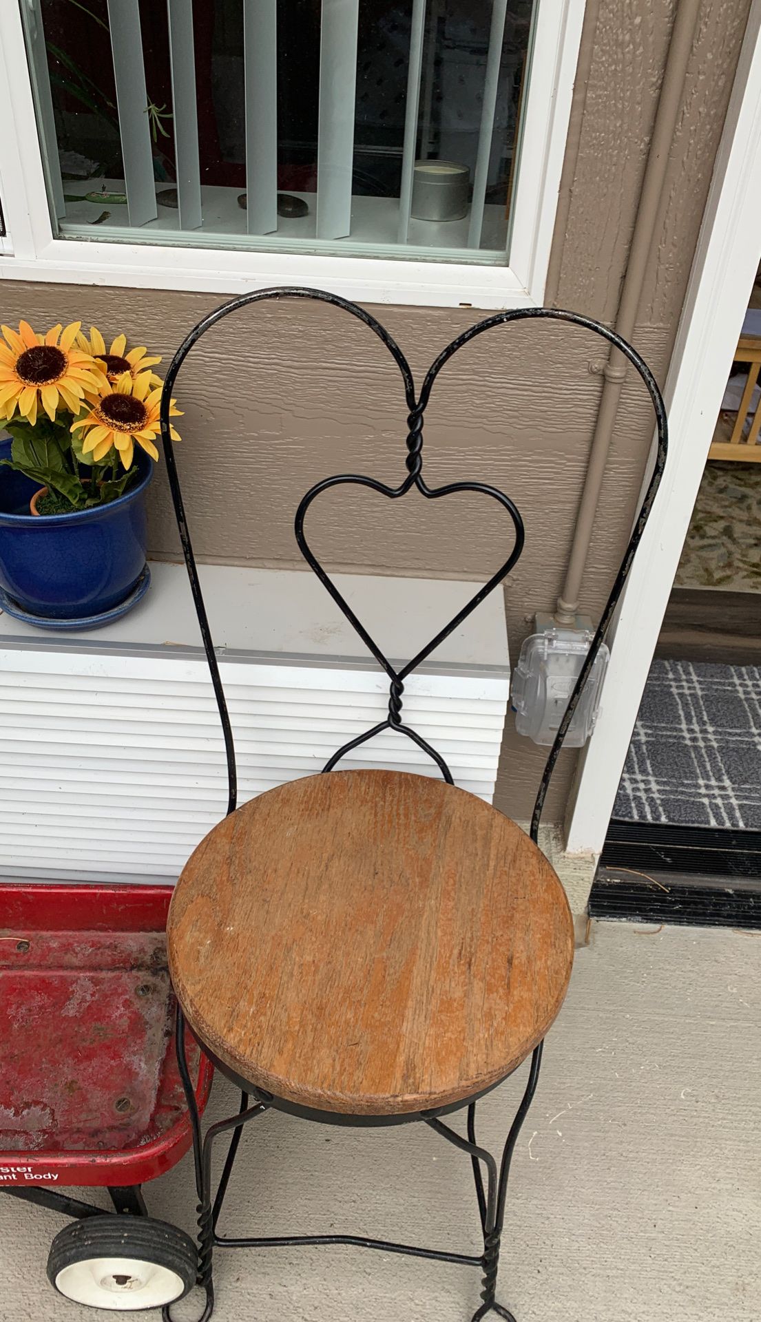 Pair of old iron and wooden heart chairs.