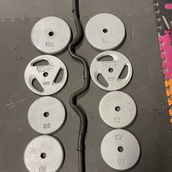 Weight Plates / Curl Bar.     70 Dollars 