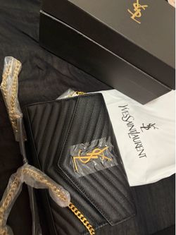 Black purse with gold chain