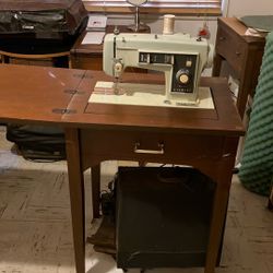    Working sewing machine in cabinet