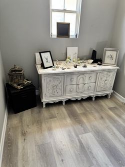 White Distressed Wood Dresser with Carved Details