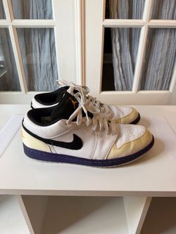 These are the Air Jordan 1 Low "Lakers Top 3" (Style Code: 553558-113), featuring a white leather upper, black swoosh, imperial purple outsole/midsole