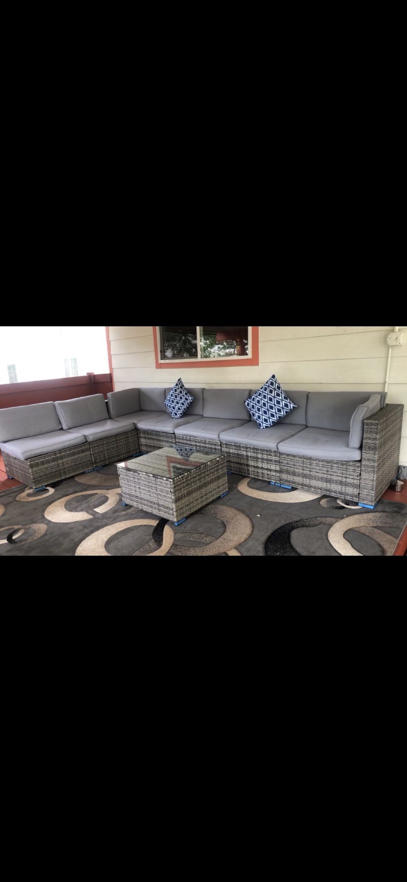 Back patio 8 Piece couch is brand new Good condition