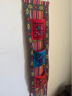 Spectacular textile wall tapestry and organizer, made completely by hand in the Middle East, full of history, tradition and symbolism