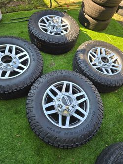 Ford 250 rims good tires all terrain