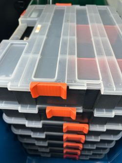 a set of black interlocking storage organizers with transparent lids