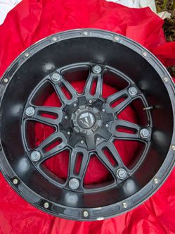 Fuel Off-Road Hostage series wheel (specifically the D531 Matte Black finish variant featuring an aggressive 8-spoke split design with decorative oute