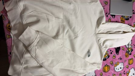 The NorthFace hoodie off whitish color