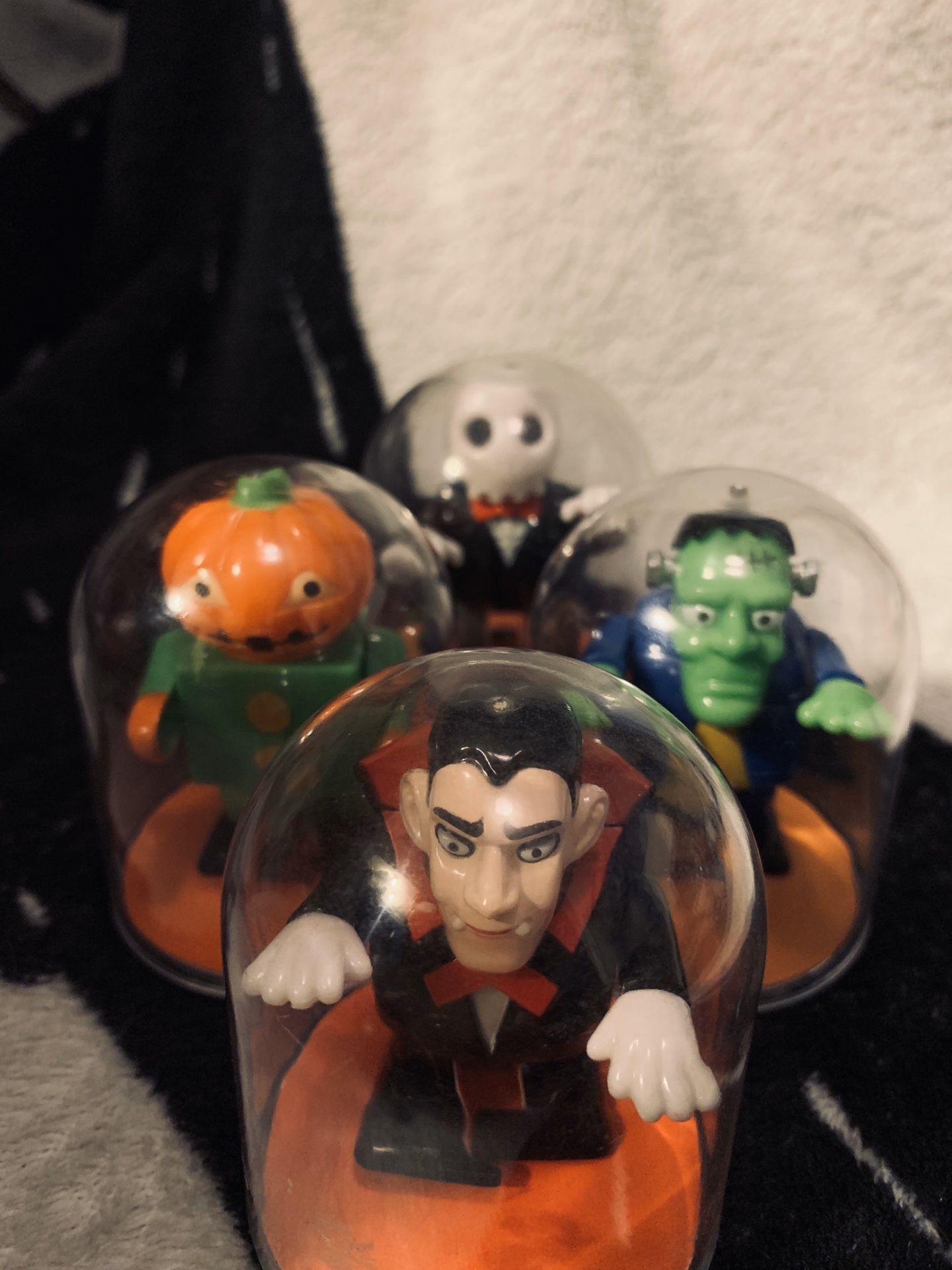 Halloween monsters collectable wind up toys in protective cases.