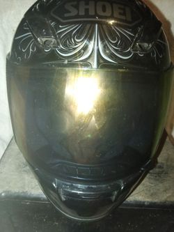Shoei full face motorcycle helmet. Has gold colored face shield and all inner helmet parts included. Helmet is in very good condition and is size Smal