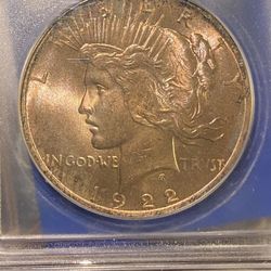 1922 golden toned ICG ms65 one dollar piece, silver dollar