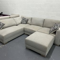 Drayden Fabric Sectional with Ottoman Floor Model