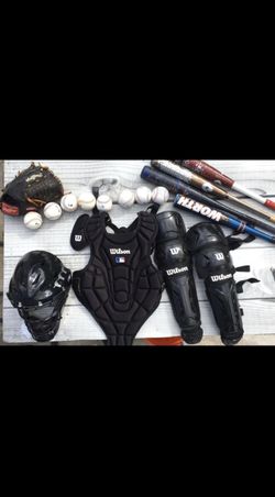 Baseball pads,helmet,bat, and balls.