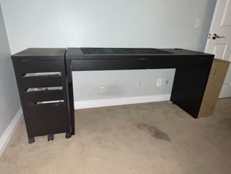 Desk with two drawers on top and more on side plus two unopened boxes for additional side drawers