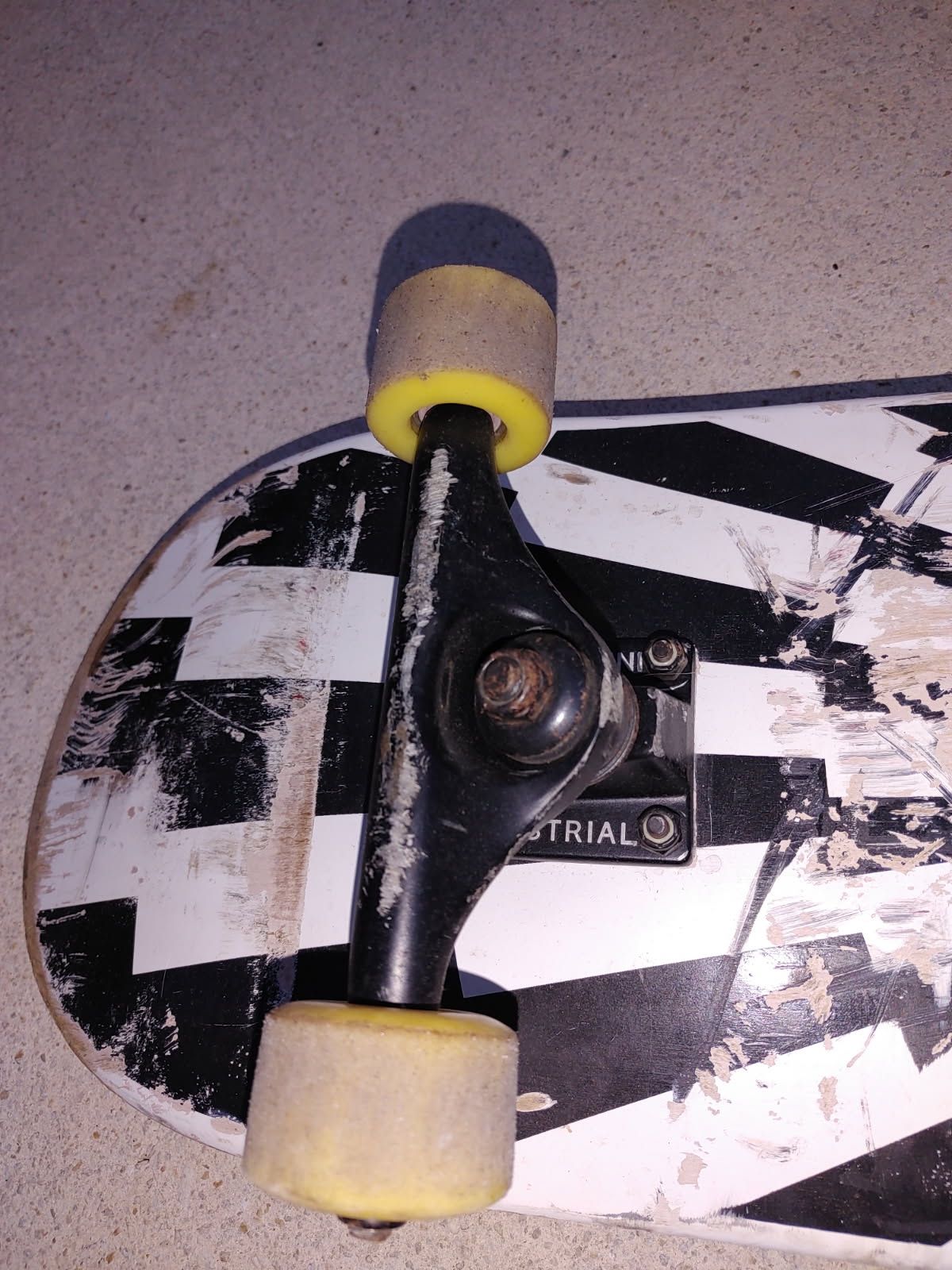 Preowned skate board with industrial trucks
