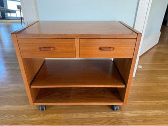 Teak media cabinet on wheels