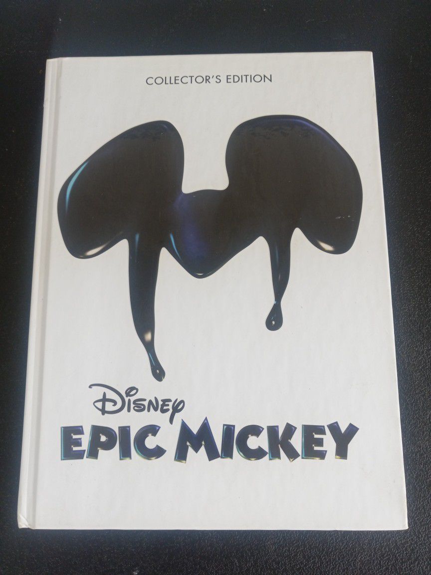 EPIC MICKEY COLLECTOR'S EDITION GAME STRATEGY  IN GOOD CONDITION THE INSIDE IS NR MINT