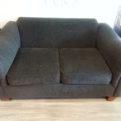 Grey Comfy  Loveseat Missing Back Cushions But Still Super Comfortable 