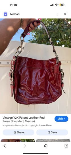 This is a vintage Coach Y2K patent leather red hobo shoulder bag.