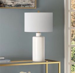 Henn&Hart 25" Traditional 1-Light Table Lamp, Flat White Ceramic base and soft fabric shade bring timeless style and ambient lighting to living rooms.