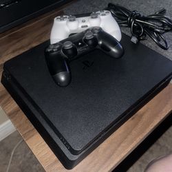PS4 Slim 1TB storage + 2 Controllers + Games