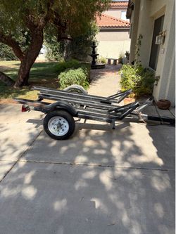 Triple motor cycle trailer with ramp